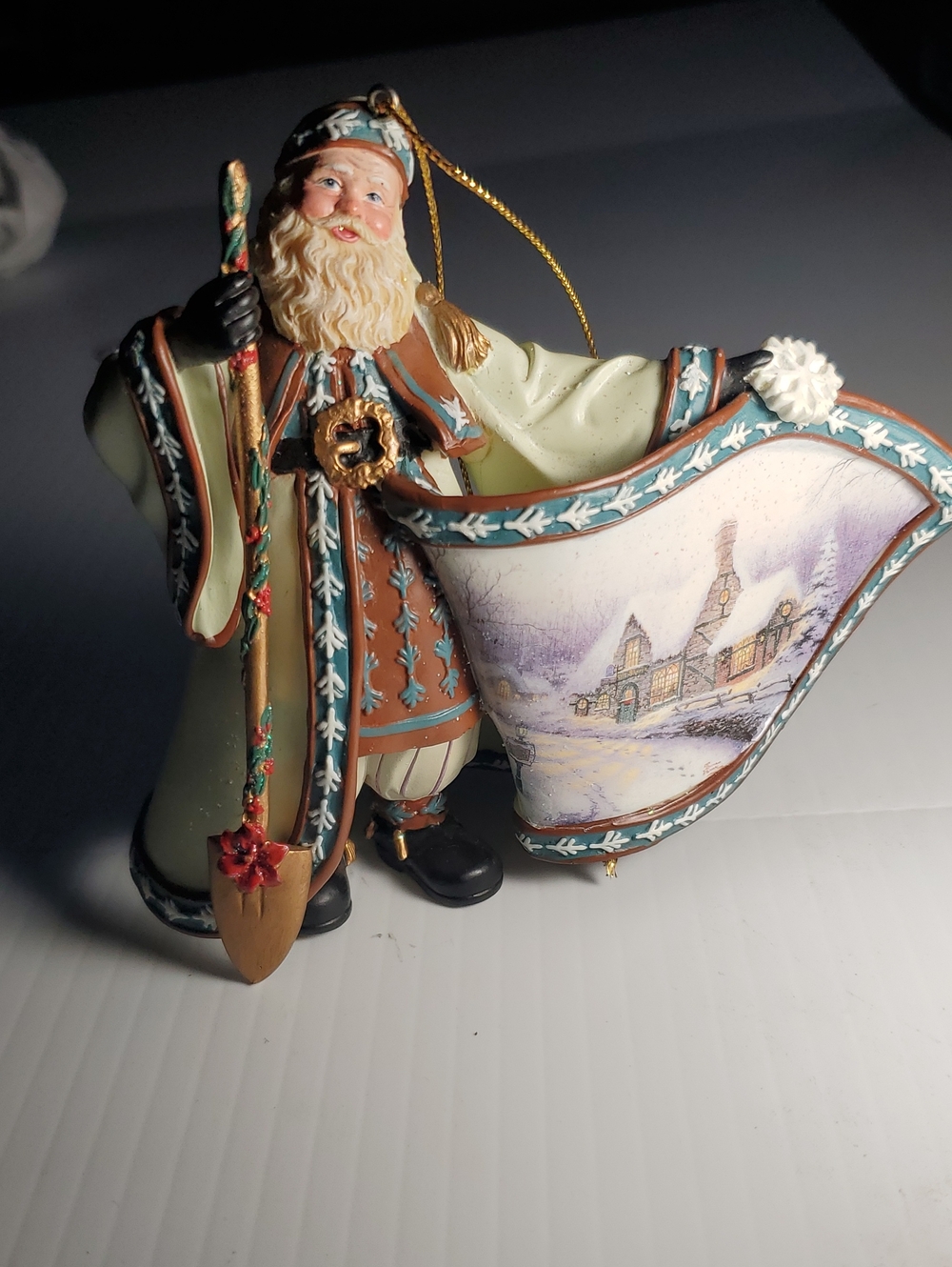 Thomas Kinkade Winter Santa Ornament in Cream, Brown & Teal